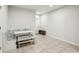 Eat-in kitchen features a white table with a cozy booth and tile flooring at 255 Blueberry Ln, Davenport, FL 33837