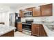 Stylish kitchen features stainless steel appliances and granite countertops at 255 Blueberry Ln, Davenport, FL 33837