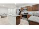 Bright kitchen features stainless steel appliances and granite countertops at 255 Blueberry Ln, Davenport, FL 33837