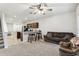 Spacious living room with an open floor plan that features a bar, sofa, and staircase at 255 Blueberry Ln, Davenport, FL 33837