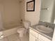 Clean bathroom featuring a shower-tub combination, toilet, and vanity with a sink at 2562 Lakeway Branch Way # 3002, Orlando, FL 32839