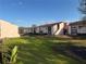 Charming condo community with well-maintained lawns and private balconies under a blue sky at 2562 Lakeway Branch Way # 3002, Orlando, FL 32839