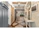 Inviting hallway features wood flooring, wood beams and decorative accents at 2600 Robie Ave, Mount Dora, FL 32757