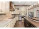 Spacious kitchen featuring granite countertops, stainless steel appliances, and custom cabinetry at 2600 Robie Ave, Mount Dora, FL 32757