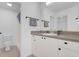 Clean bathroom with a large mirror and modern vanity at 2606 Olivarez Way, The Villages, FL 32162