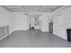 Spacious, freshly painted garage with epoxy flooring and built-in cabinets at 2606 Olivarez Way, The Villages, FL 32162