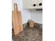 A close-up of the kitchen counter featuring a wood cutting board and jar at 2606 Olivarez Way, The Villages, FL 32162