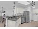 Bright kitchen features modern appliances, ample counter space, and stylish lighting at 2606 Olivarez Way, The Villages, FL 32162