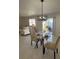 Comfortable open-concept living space with dining area and sliding glass doors at 2606 Olivarez Way, The Villages, FL 32162