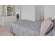 Bright main bedroom featuring built-in shelves, storage, and ensuite bathroom at 2606 Olivarez Way, The Villages, FL 32162