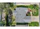 Aerial view of the home highlighting the landscaped yard, patio, and roof at 2738 Privada Dr, The Villages, FL 32162