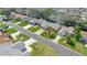 Aerial view of the neighborhood showcasing the home's landscaping and proximity to other homes at 2738 Privada Dr, The Villages, FL 32162