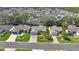 Aerial view of the community featuring tree lined street and manicured lawns at 2738 Privada Dr, The Villages, FL 32162