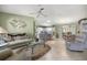Spacious living room features tile flooring and a large window offering ample natural light at 2738 Privada Dr, The Villages, FL 32162
