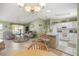 Bright and airy living space seamlessly connects the kitchen, dining, and living areas at 2738 Privada Dr, The Villages, FL 32162