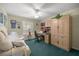 Office includes a built-in desk and Murphy bed for versatile functionality at 2738 Privada Dr, The Villages, FL 32162