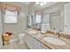Bright bathroom features double sinks with granite counters and decor at 2746 Park Royal Dr, Windermere, FL 34786