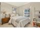 Charming bedroom with a comfortable bed, bookshelf and natural light at 2746 Park Royal Dr, Windermere, FL 34786