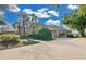 Exterior view of house showing driveway, landscaping, and attached garage at 2746 Park Royal Dr, Windermere, FL 34786