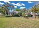 Expansive lawn leads up to an inviting single-story home with a well-maintained exterior at 2746 Park Royal Dr, Windermere, FL 34786