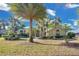 Stunning single-story home with mature palm trees and meticulous landscaping enhancing curb appeal at 2746 Park Royal Dr, Windermere, FL 34786