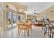Open-concept living space features a dining area, fireplace, and views of the outdoor patio at 2746 Park Royal Dr, Windermere, FL 34786
