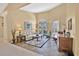 Bright living room features tile flooring, arched windows, and elegant furnishings at 2746 Park Royal Dr, Windermere, FL 34786