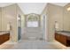 Serene bathroom with a large soaking tub, a glass shower, and dual vanities for ultimate relaxation at 2746 Park Royal Dr, Windermere, FL 34786