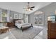 Spacious main bedroom boasting a ceiling fan, ample natural light, and access to an outdoor space at 2746 Park Royal Dr, Windermere, FL 34786