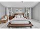 Comfortable bedroom showcasing neutral decor, and natural light streaming through the windows at 2746 Park Royal Dr, Windermere, FL 34786