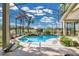 Stunning screened in pool and spa featuring manicured garden landscaping at 2746 Park Royal Dr, Windermere, FL 34786