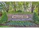 Landscaped community entrance sign for Windsor Hill with stone accents at 2746 Park Royal Dr, Windermere, FL 34786