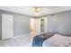 A bedroom features a stackable washer and dryer closet at 3011 George Mason Ave # 3, Winter Park, FL 32792