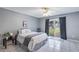 A cozy bedroom featuring a sliding glass door with access to a landscaped yard at 3011 George Mason Ave # 3, Winter Park, FL 32792