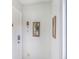 Hallway with neutral paint, art fixtures, and a white door at 3011 George Mason Ave # 3, Winter Park, FL 32792