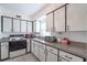 Well-equipped kitchen with white cabinets, modern appliances, and ample counter space at 3011 George Mason Ave # 3, Winter Park, FL 32792