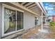 An outdoor patio with a sliding glass door leads to the interior living space at 3011 George Mason Ave # 3, Winter Park, FL 32792