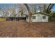 This generous backyard has a screened-in porch which provides a comfortable outdoor living space at 30713 George Dr, Tavares, FL 32778