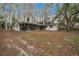 View of a big yard and screened in patio which is perfect for enjoying the outdoors while staying protected from insects at 30713 George Dr, Tavares, FL 32778