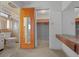 Bathroom with a tiled shower and storage at 30713 George Dr, Tavares, FL 32778