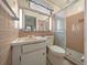 Bathroom with tiled shower and coordinated fixtures at 30713 George Dr, Tavares, FL 32778