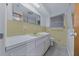 Bathroom area features white sink, yellow tile and shower/tub combo at 30713 George Dr, Tavares, FL 32778
