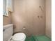 Cozy half-bathroom with a toilet, and an open space indicating shower removal with mounted shower hardware still in place at 30713 George Dr, Tavares, FL 32778