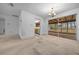 Dining area with chandelier lighting and sliding doors to the lanai at 30713 George Dr, Tavares, FL 32778