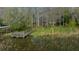 Aerial shot of a lake with dock, pier house and surrounding trees at 30713 George Dr, Tavares, FL 32778