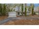 Charming single-story home features an attached garage and mature trees in the front yard at 30713 George Dr, Tavares, FL 32778