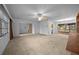 Spacious living room featuring neutral carpet and lots of windows and natural light at 30713 George Dr, Tavares, FL 32778