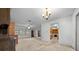 Spacious living room features natural light, ceiling fan, and built-in shelving at 30713 George Dr, Tavares, FL 32778