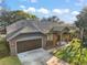 Beautiful home showcasing its architectural design, landscaping, and long driveway at 3130 Bulkley Pl, Eustis, FL 32726