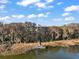 Aerial view of a dock on a tranquil lake surrounded by Spanish moss-draped trees at 3130 Bulkley Pl, Eustis, FL 32726